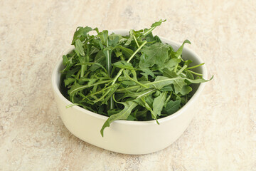 Fresh green arugula in the bowl