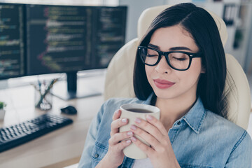 Portrait of calm lady editor front end finish operating system improving pause smell fresh hot mug...