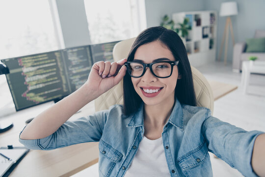 Portrait of smart chinese lady front end specialist make selfie video call seminar platform optimization in workstation - Powered by Adobe