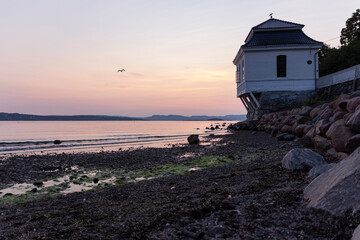 sunset at the beach norway fiords birds small house