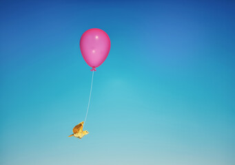 Fototapeta na wymiar Bird flying with a balloon.