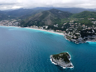 Fototapeta premium Aerial view of Bergeggi island, heart island from above, in Liguria, north Italy. Drone photography of the Ligurian coast, province of Savona with Spotorno and the island of Bergeggi.