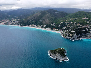 Fototapeta premium Aerial view of Bergeggi island, heart island from above, in Liguria, north Italy. Drone photography of the Ligurian coast, province of Savona with Spotorno and the island of Bergeggi.