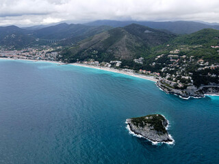 Aerial view of Bergeggi island, heart island from above, in Liguria, north Italy. Drone photography of the Ligurian coast, province of Savona with Spotorno and the island of Bergeggi.