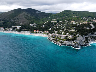 Fototapeta premium Aerial view of Bergeggi island, heart island from above, in Liguria, north Italy. Drone photography of the Ligurian coast, province of Savona with Spotorno and the island of Bergeggi.