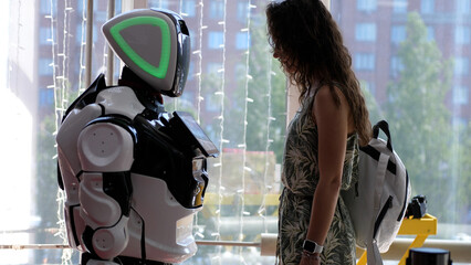A cyborg and a young woman are cooperating each other