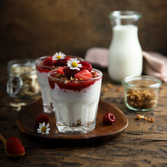Yogurt dessert with granola and berries