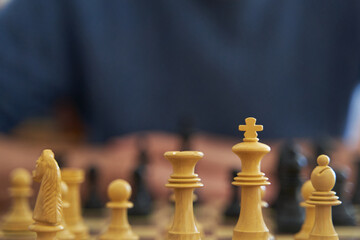 Intelligence and leadership concept. Detail of chess pieces on board