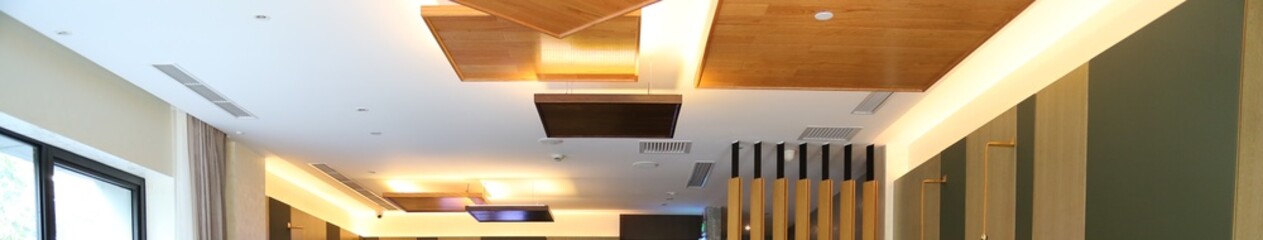 modern ceiling and lighting design with spotlight and square shape wood panels decor. Restaurant,...