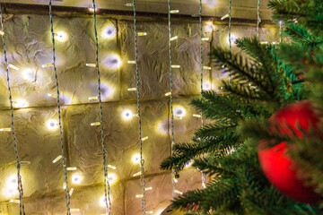 Close up of balls on christmas tree. Bokeh garlands in the background. New Year concept.