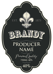 Vector label for Brandy with a hand-drawn fleur de lis on a black background in a curly frame. Figured label or sticker for strong alcohol drinks in retro style, isolated on a white background © paseven