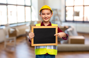 building, construction and profession concept - little boy in protective helmet and safety vest...