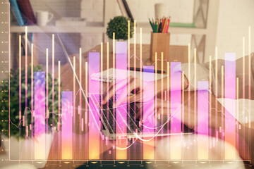 Double exposure of woman hands typing on computer and forex chart hologram drawing. Stock market invest concept.