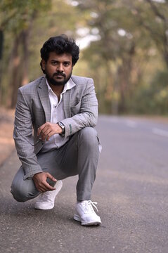 man sitting on the road