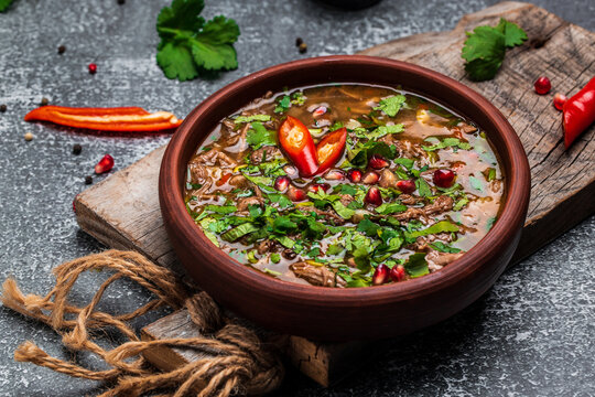 Georgian Kharcho lamb meat soup. Georgian dish chakapuli or the Turkish dish Alluciye. Keto diet dish. Georgian cuisine. banner, menu, recipe place for text, top view