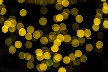 Elegant and romantic golden Christmas lights background with bokeh