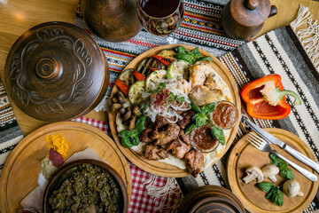 delicious European and Slavic cuisine on the big table waiting for guests. table with food, top view - obrazy, fototapety, plakaty