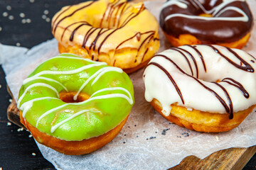 glazed donut on wood background.