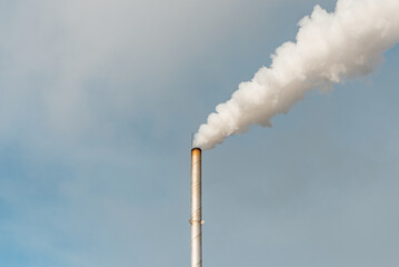 Pipe and smoke.Polluting air with white smoke from industrial chimney outdoors. CO2 emissions.Copy...