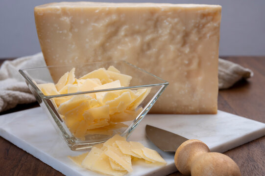 Flakes of parmesan cheese, italian hard parmigiano-reggiano cheese from Reggio Emilia region
