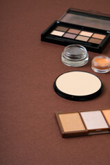 Group of cosmetic and makeup products on studio background
