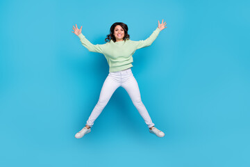 Fototapeta premium Full length photo of impressed young brunette lady wear shirt pants footwear isolated on blue background