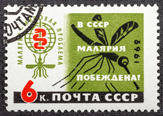 USSR - CIRCA 1962: A stamp printed in USSR shows Malaria Eradication Emblem and Mosquito, 1962