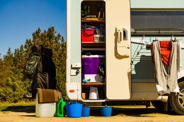 Washing laundry outdoor at caravan