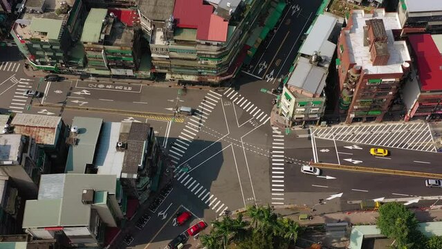sunny day taipei city flight over living block traffic crossroad aerial topdown panorama 4k taiwan