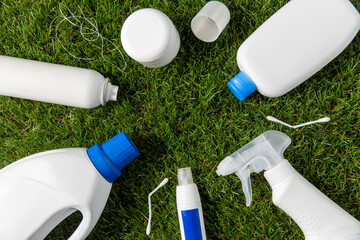 recycling, environment and ecology concept - close up of plastic and household chemicals waste on...