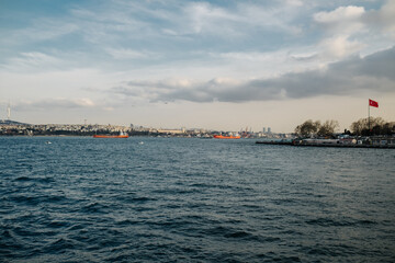 Bosphorus view, cargo ships passing through the strait and a sunny day, a blue sky and an open sea, a unique view in Istanbul, Istanbul,Turkiye,01-30-2022