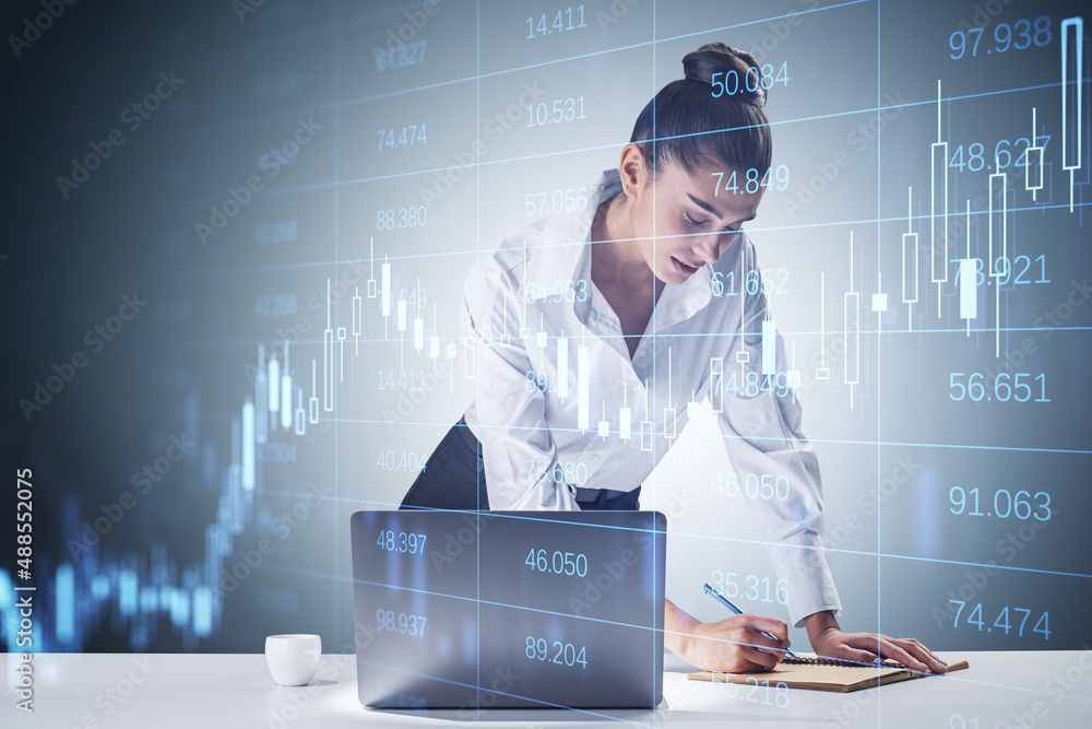 Poster attractive young businesswoman working at desktop with laptop and abstract glowing grid with index a
