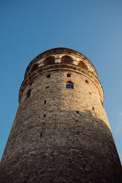 Galata tower, the castle with a historical Istanbul image, a shot of architecture from below and a blue sky, Istanbul,Turkiye,01-30-2022