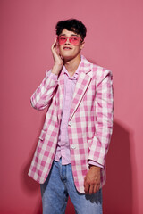 Fototapeta premium Photo of romantic young boyfriend pink shirt and glasses jacket fashion elegant style model studio