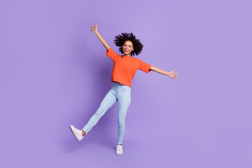 Full size photo of cute energetic delighted girl dancing spend free time summer vacation isolated on purple color background