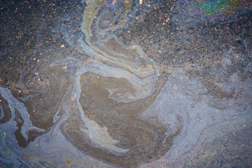 Oil stain on Asphalt, color Gasoline fuel spots on Asphalt Road
