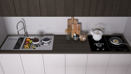 Dark wooden modern kitchen, sink with fruit, hob with pot, fried egg in a pan. Vase with spikes, wooden cutting boards. Top view, above with copy space, interior design idea