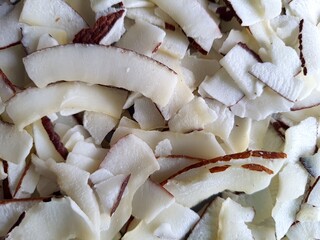 Detail of dried shaved coconut flakes. From above.