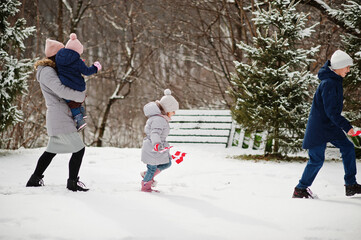 Family with Denmark flags outdoor in winter. Travel to Scandinavian countries. Happiest danish people's .