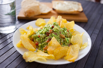 appetizer on a plate. Guacamole with chips