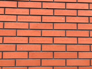 Obraz premium Orange brick wall. Wall ornament for background.