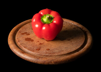 red bell pepper on wooden board