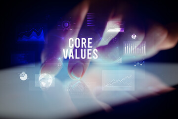 Finger touching tablet with business graphs and icons concept