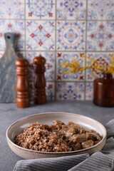 Meat with buckwheat on the table in the kitchen