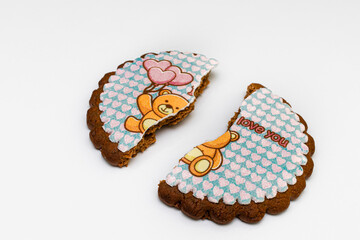 two halves of one gingerbread with a declaration of love lie