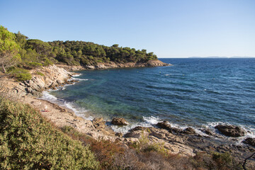 Hidden small bay with a rocky and sandy beach and a breathtaking view to the mediterranean under...