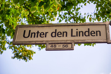 Unter den Linden street sign under the trees of Berlin, Germany