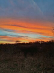 Obraz premium sunset over the field