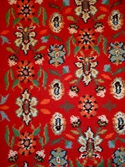 The texture of the Persian carpet, abstract ornament. Round Mandala Pattern, Traditional Texture Of Middle Eastern Carpet Fabric. Red, milky green, beige, light green, brown. vintage, oriental motifs