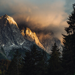 Germany's highest mountain, Zugspitze and its ridge colored red by the last rays of sunset. Sunset...